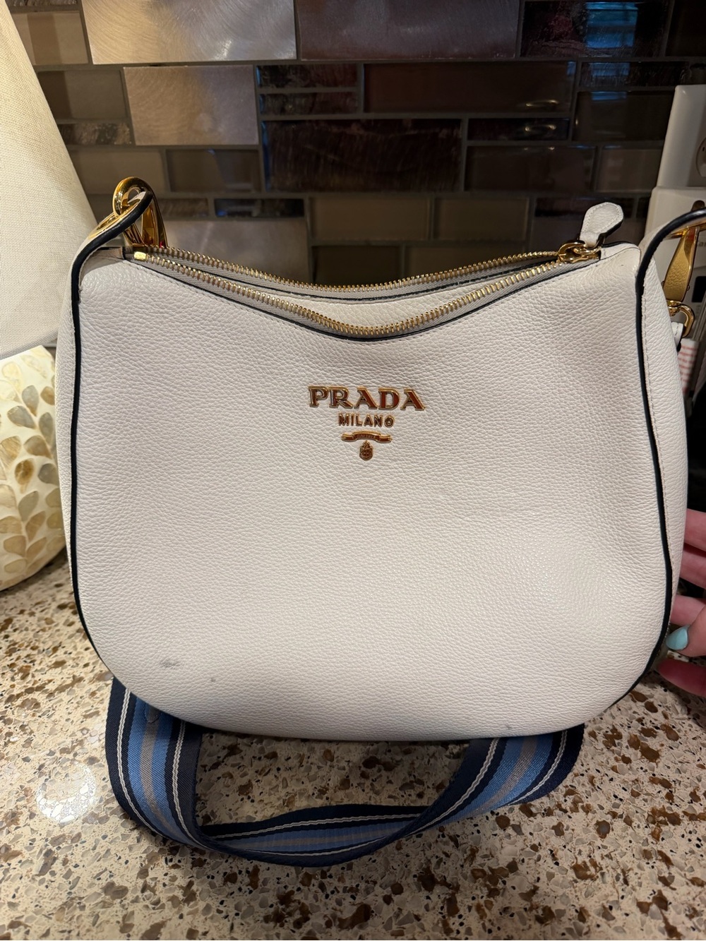 Prada White Pebbled Leather Shoulder Bag with Gold Logo and Blue Striped Strap